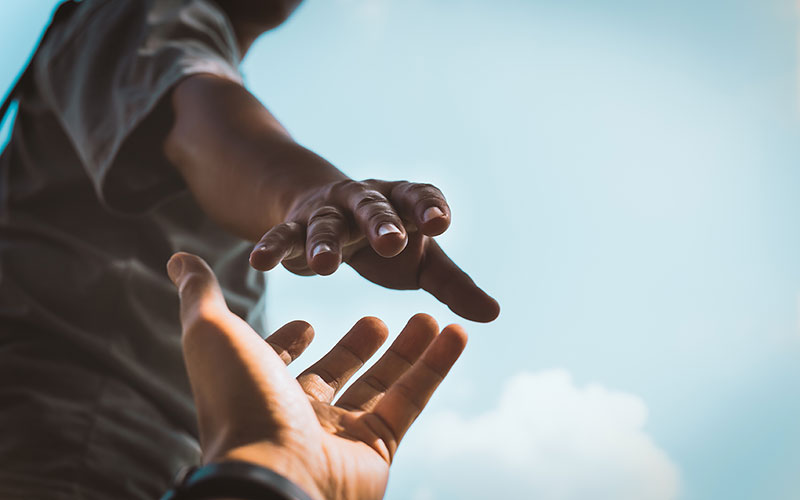 Hands reaching out to help
